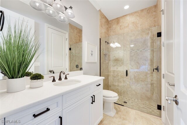 bathroom with toilet, tile patterned flooring, vanity, and walk in shower