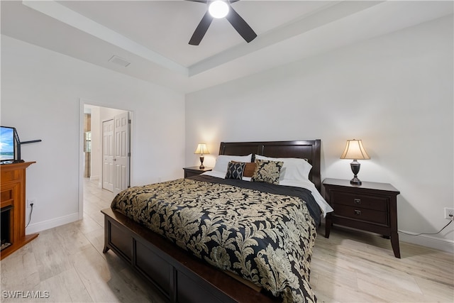 bedroom featuring ceiling fan and light hardwood / wood-style floors