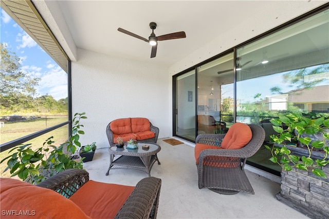 sunroom / solarium with ceiling fan