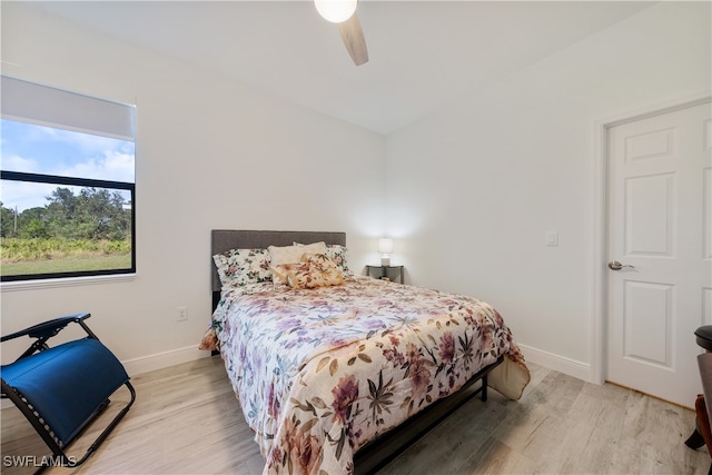 bedroom featuring ceiling fan and light hardwood / wood-style flooring