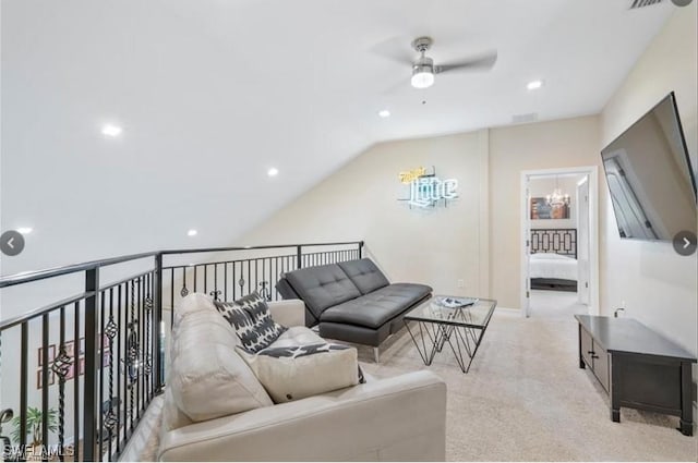 living room with ceiling fan, light carpet, and vaulted ceiling