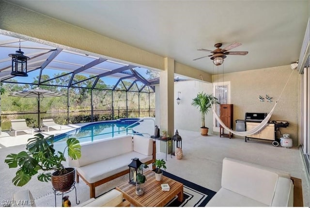 view of patio / terrace with glass enclosure and ceiling fan