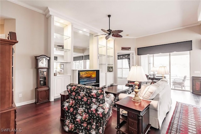 living room with built in shelves, ceiling fan, dark hardwood / wood-style flooring, and crown molding