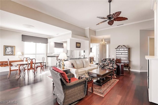 living room with dark hardwood / wood-style flooring, ceiling fan with notable chandelier, and ornamental molding