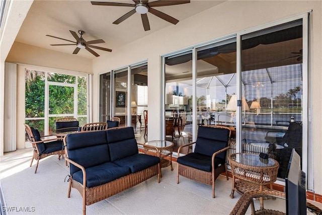 sunroom / solarium featuring ceiling fan