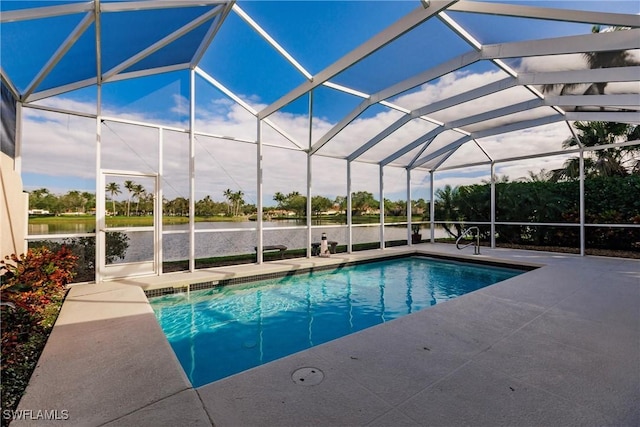 view of swimming pool featuring a lanai, a patio, and a water view