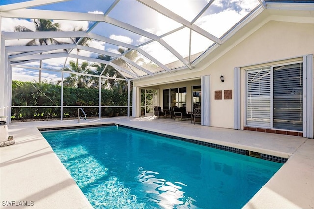 view of pool with a lanai and a patio