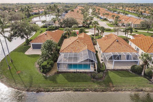 drone / aerial view with a water view