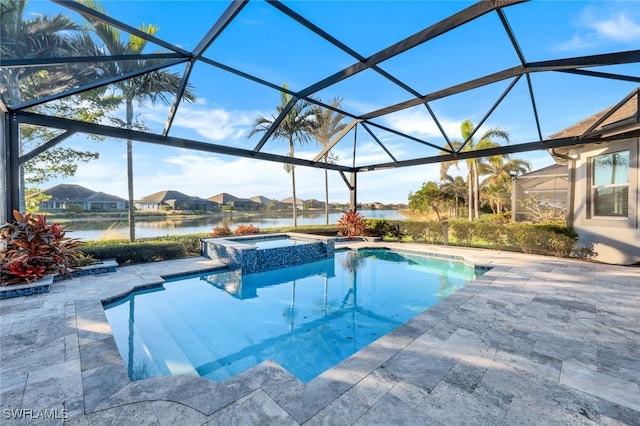 view of pool featuring an in ground hot tub, a patio, a water view, and glass enclosure