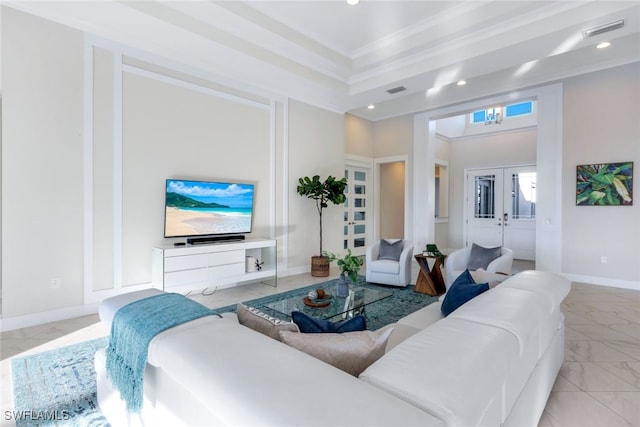 living room featuring french doors and crown molding