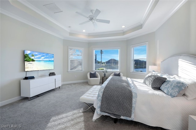 bedroom featuring light colored carpet, ceiling fan, crown molding, and a tray ceiling