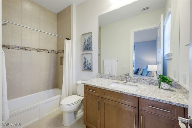 full bathroom featuring toilet, tile patterned flooring, vanity, and shower / tub combo with curtain