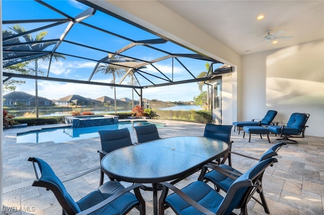 view of patio / terrace with ceiling fan, a pool with hot tub, and a lanai