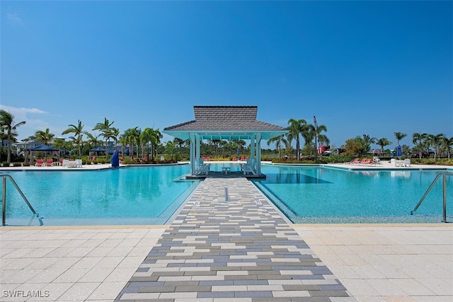 view of swimming pool with a gazebo and a patio