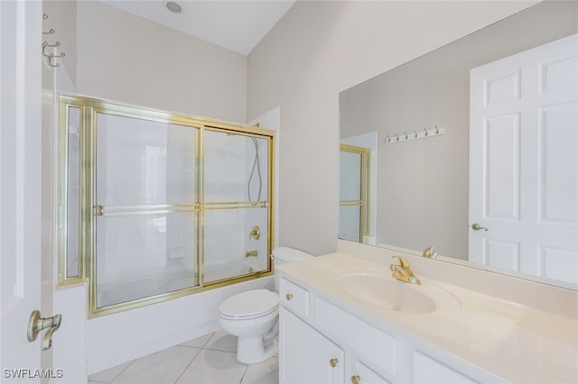 full bathroom featuring tile patterned flooring, vanity, toilet, and enclosed tub / shower combo