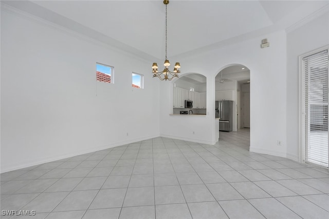 interior space featuring crown molding and a notable chandelier