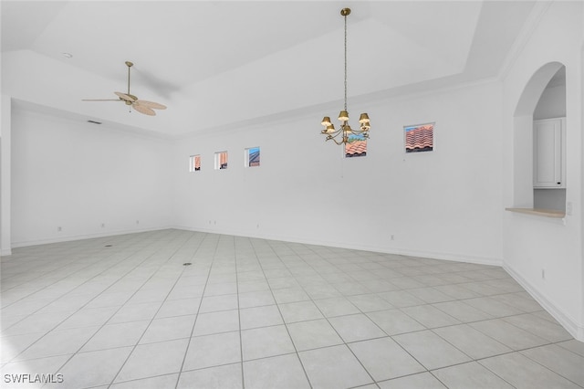 unfurnished room with light tile patterned floors, ceiling fan with notable chandelier, ornamental molding, and lofted ceiling