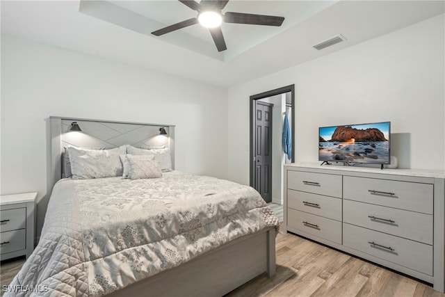 bedroom with light wood-type flooring and ceiling fan