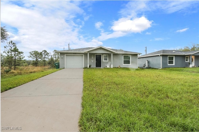 single story home with a garage and a front lawn