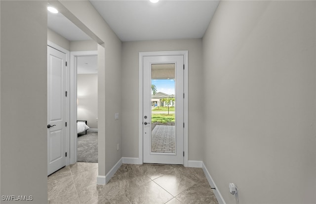 entryway featuring light tile patterned floors