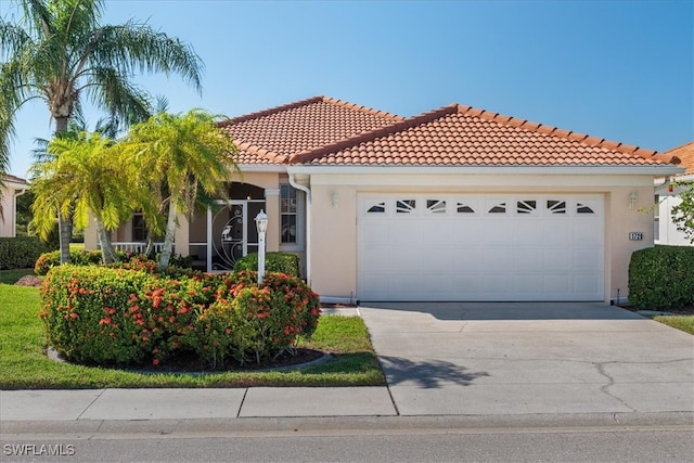 mediterranean / spanish-style house featuring a garage