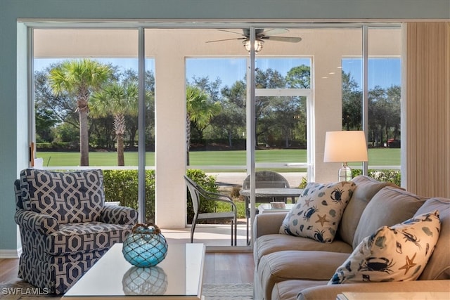 sunroom with ceiling fan and a healthy amount of sunlight