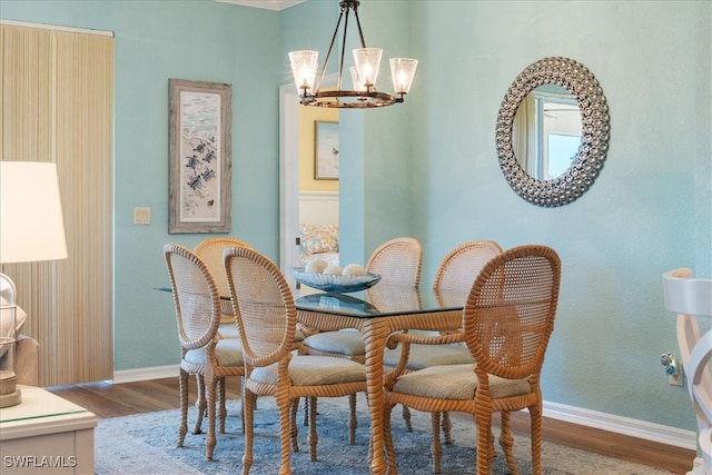 dining area with an inviting chandelier and hardwood / wood-style flooring