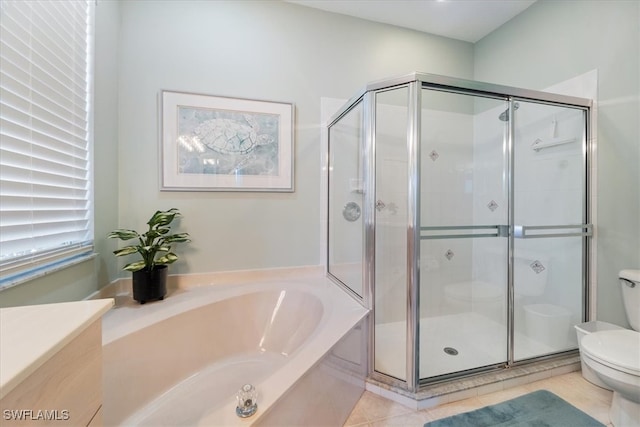 bathroom with tile patterned floors, independent shower and bath, and toilet