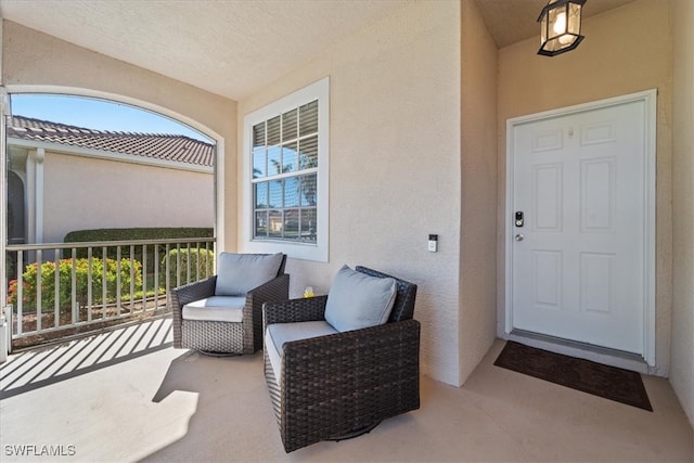 property entrance featuring a balcony