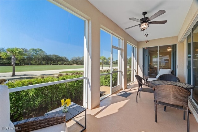 sunroom / solarium with ceiling fan