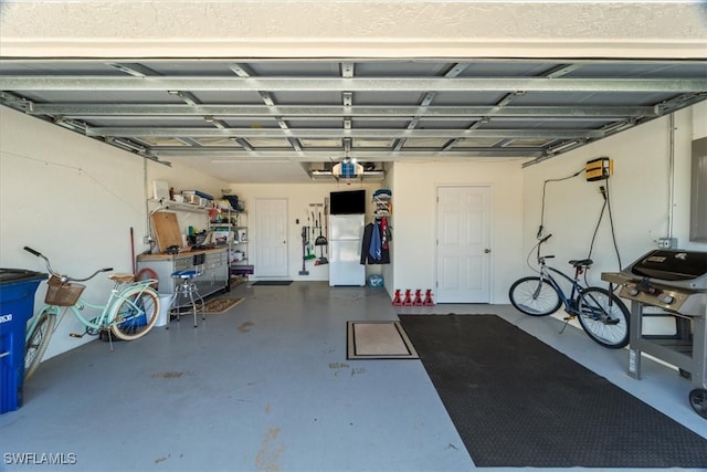 garage with white fridge