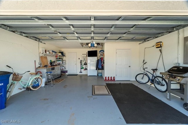 garage featuring freestanding refrigerator