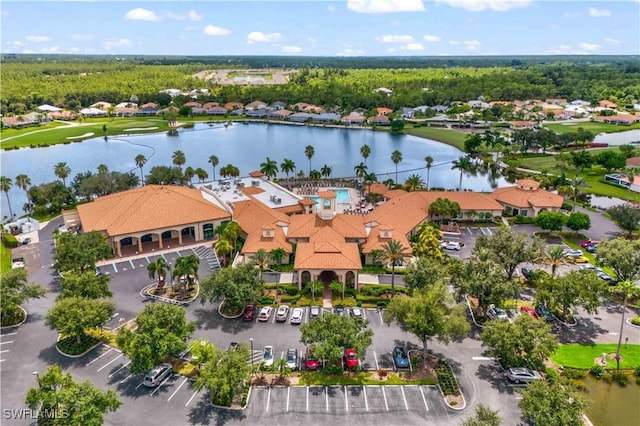 drone / aerial view featuring a residential view and a water view