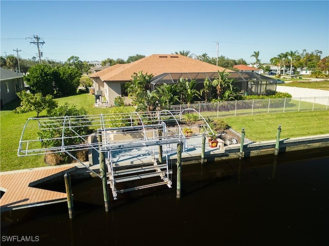 view of dock featuring a yard and glass enclosure