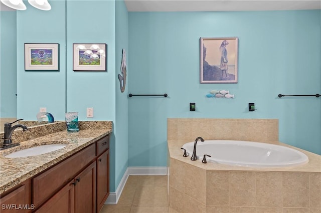 bathroom with tile patterned floors, vanity, and a relaxing tiled tub