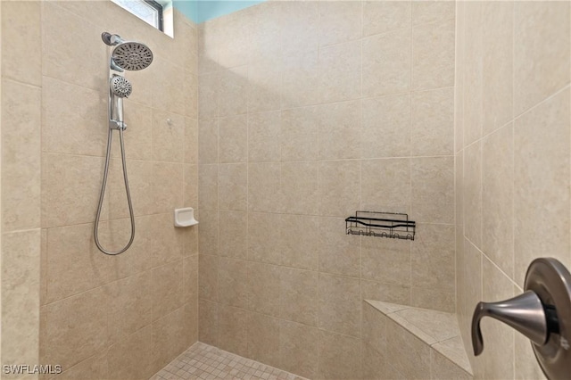 bathroom featuring a tile shower