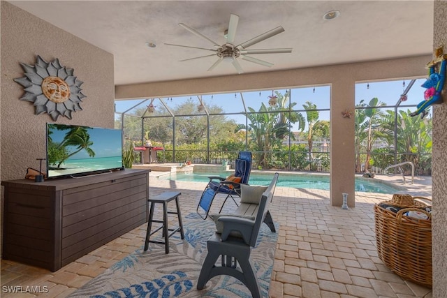 view of patio / terrace featuring ceiling fan and a lanai