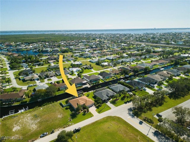 birds eye view of property featuring a water view