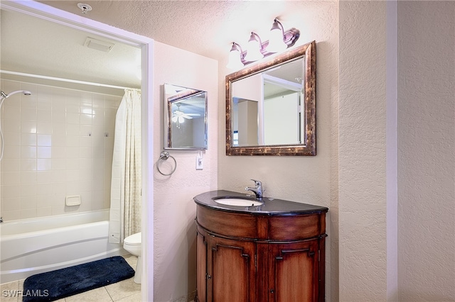 full bathroom with tile patterned floors, shower / tub combo with curtain, vanity, and toilet