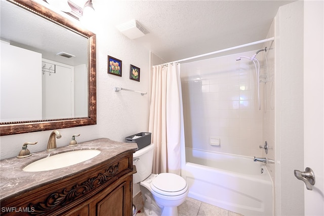 full bathroom featuring tile patterned floors, vanity, a textured ceiling, and toilet