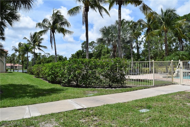 view of community featuring a yard