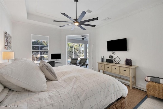 bedroom featuring ceiling fan and a raised ceiling