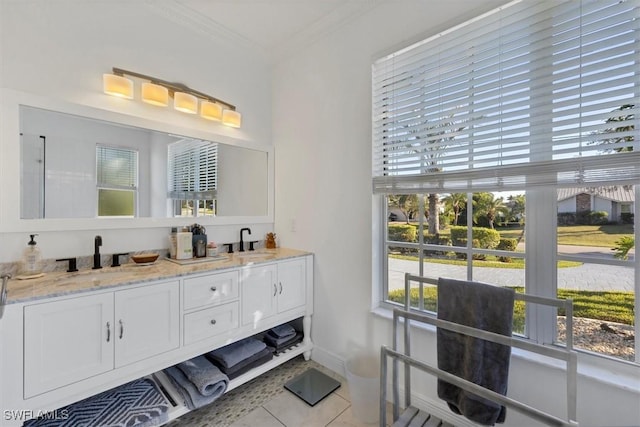 bathroom featuring tile patterned floors, vanity, and crown molding