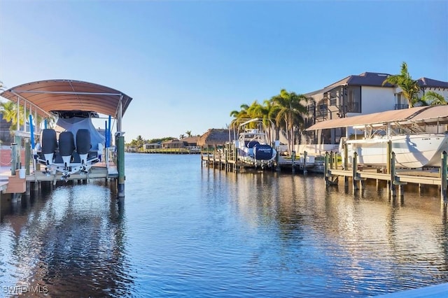 view of dock featuring a water view and boat lift