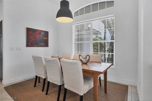 dining space with light tile patterned floors