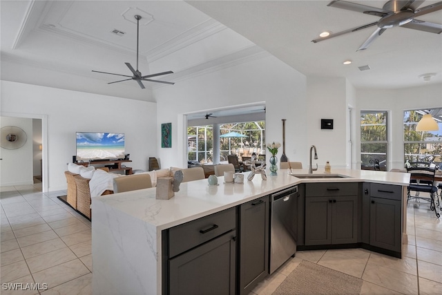 kitchen with sink, stainless steel dishwasher, a wealth of natural light, and hanging light fixtures