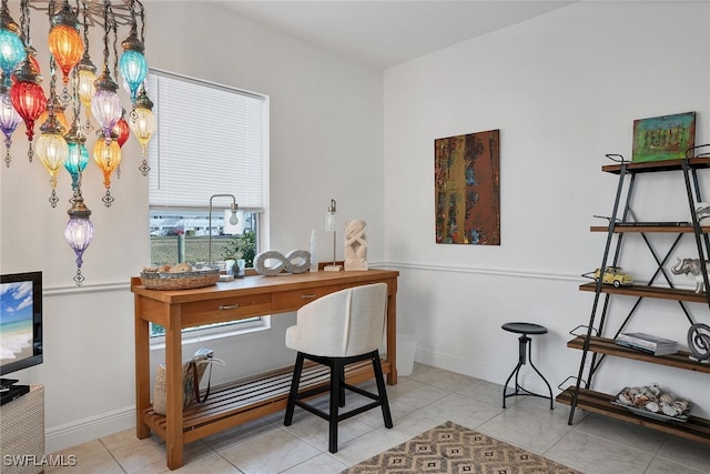 tiled home office with baseboards and an inviting chandelier