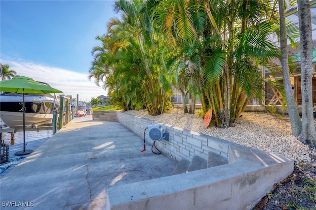 exterior space with a boat dock and boat lift