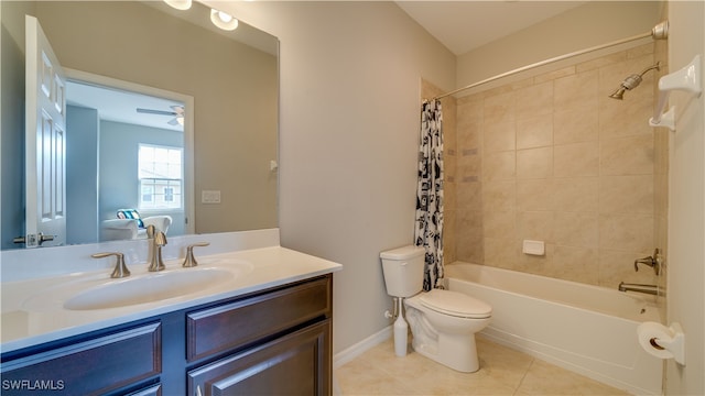 full bathroom featuring ceiling fan, tile patterned flooring, toilet, shower / bath combo with shower curtain, and vanity