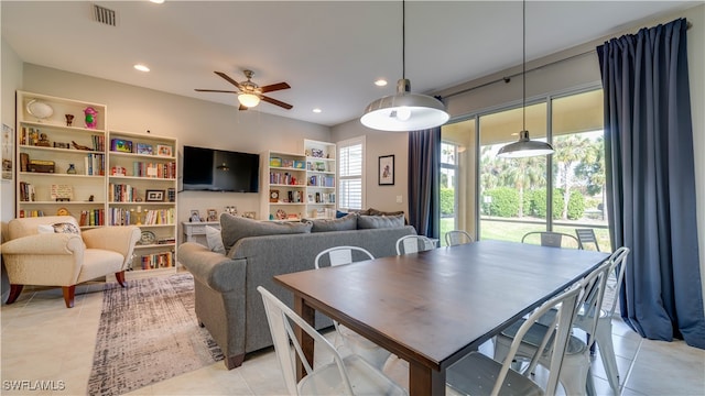 tiled dining room with ceiling fan